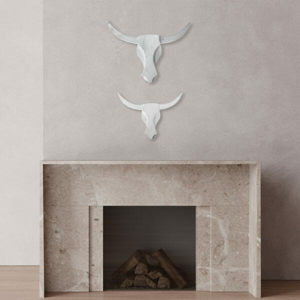 White Reclaimed Wooden Bull Heads above Fireplace