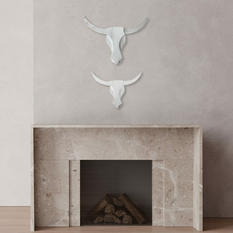 White Reclaimed Wooden Bull Heads above Fireplace
