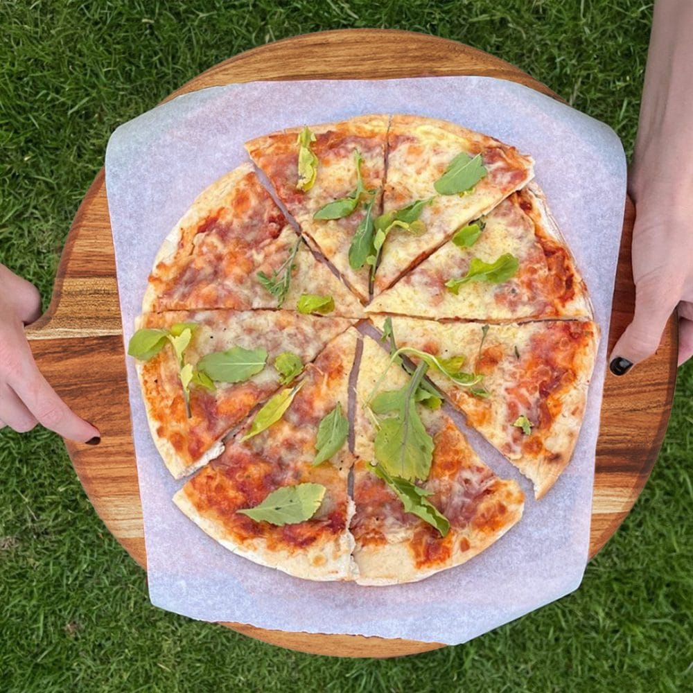 Round Wooden Pizza Serving Board with pizza