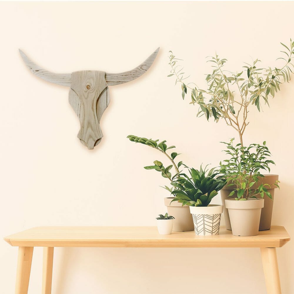 Natural Reclaimed Wooden Bull Heads on wall