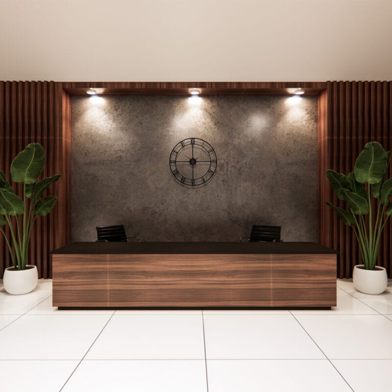 Black Roman Wall Clock above Reception Desk